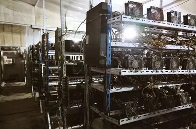 Image showing a typical mining farm setup with rows of ASICs and cooling systems